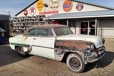 1953 Chevrolet Bel Air and vintage oil and gas signs